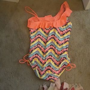 A rainbow color ruffled swimsuit